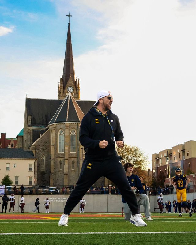 Chris Gray coaching on the field at Archbishop Moeller